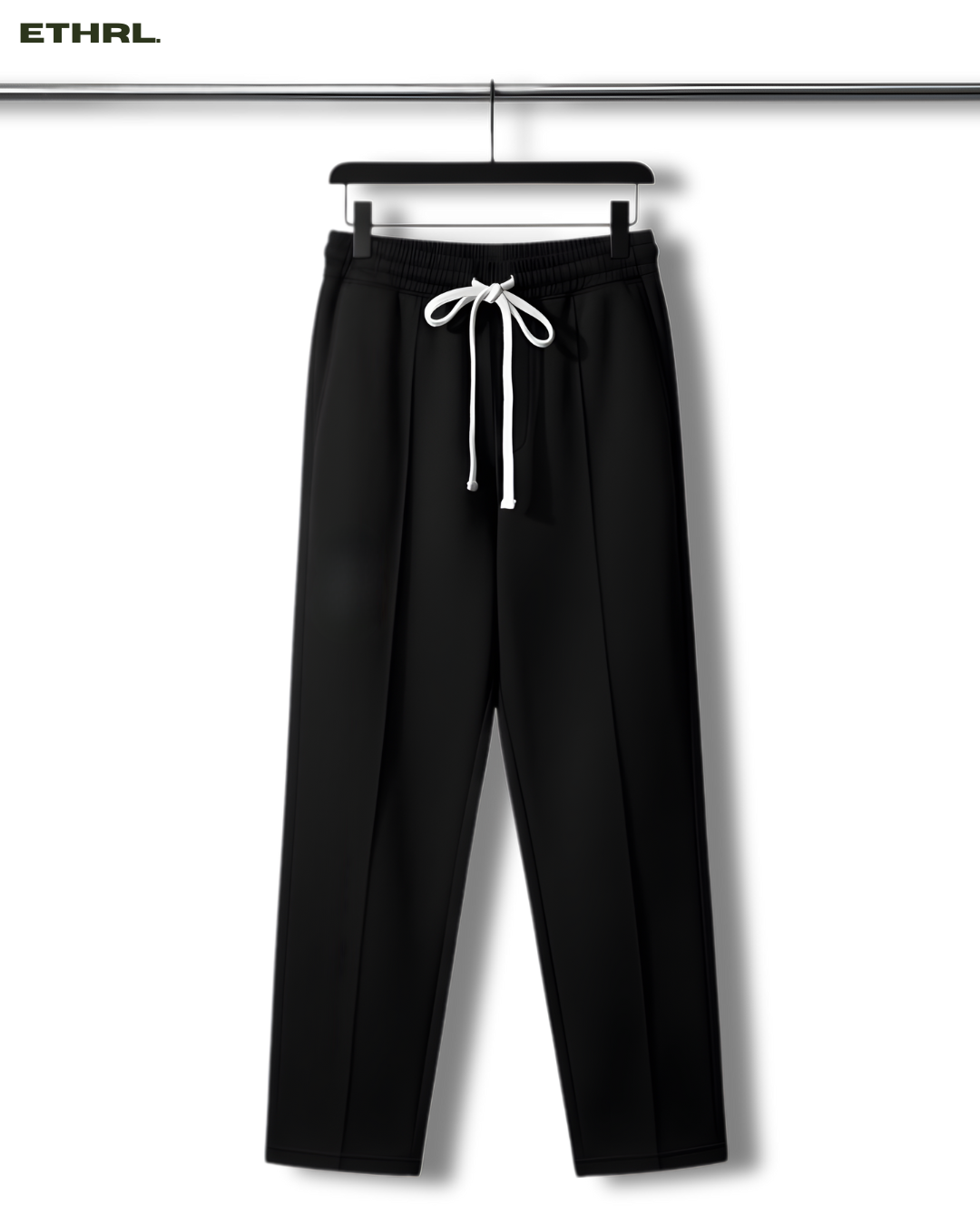Black pants with a white drawstring on a hanger against a white background, featuring the brand 'ETHRL'.